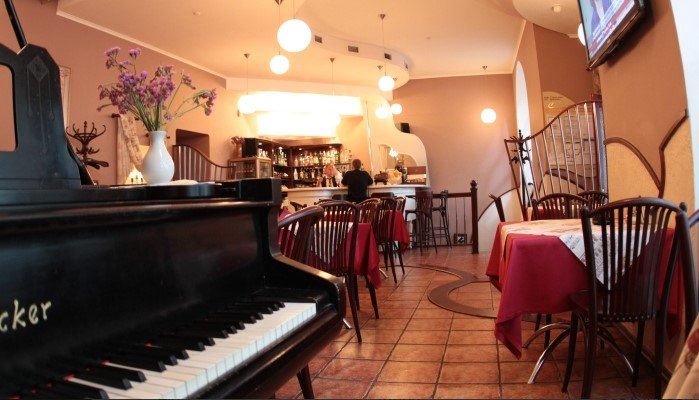 Old grand piano | Cafe Restaurant